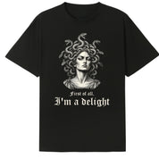 A black oversized tee with the First Of All I'm A Delight graphic printed large on the front.