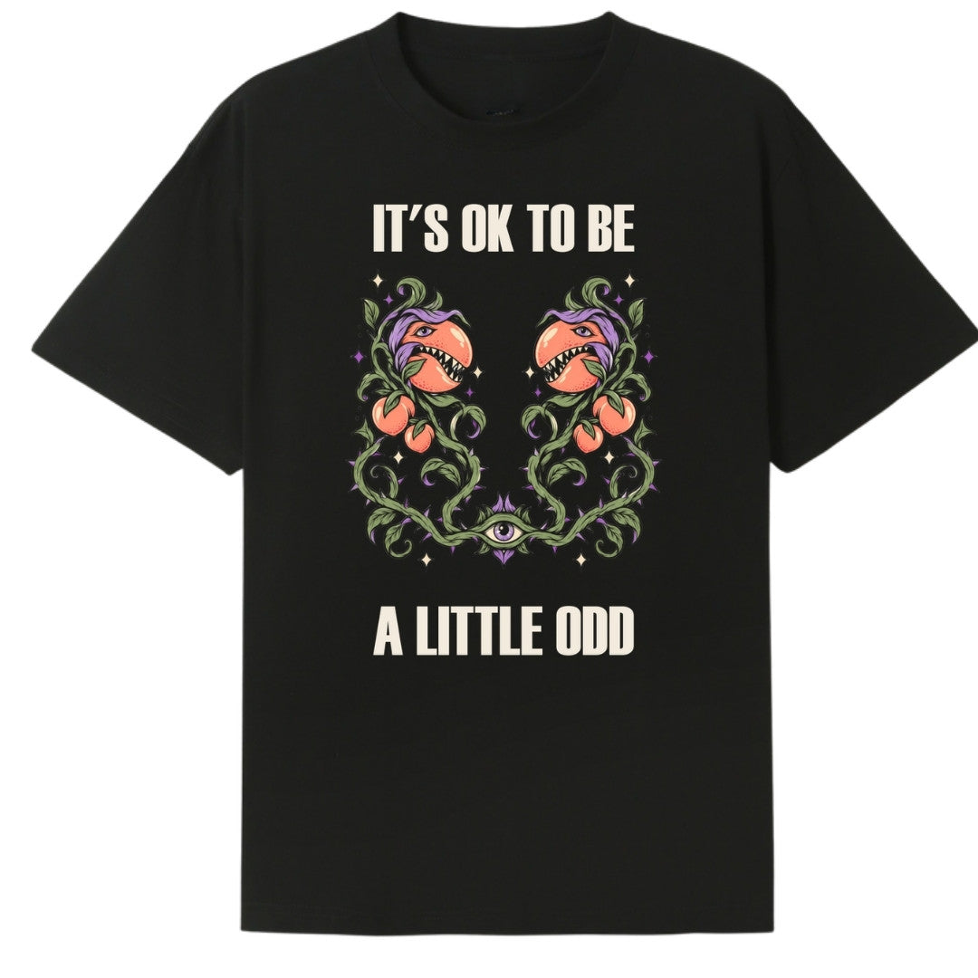 A black oversized tee with the It's OK To Be A Little Odd graphic printed large on the front.