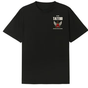 A black oversized tee with a small Get The Tattoo graphic on the left chest.