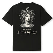 A black oversized tee shown from the back, with the First Of All I'm A Delight graphic printed large across the back.