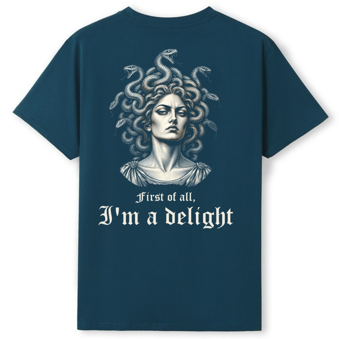A teal oversized tee shown from the back, with the First Of All I'm A Delight graphic printed large across the back.