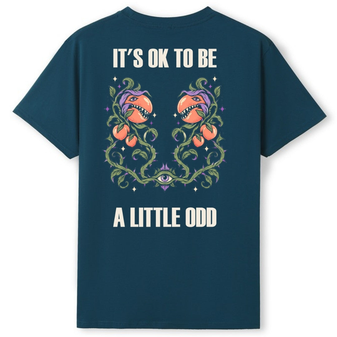 A teal oversized tee shown from the back, with the It's OK To Be A Little Odd graphic printed large across the back.