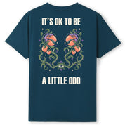 A teal oversized tee shown from the back, with the It's OK To Be A Little Odd graphic printed large across the back.