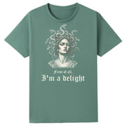 A slate green oversized tee with the First Of All I'm A Delight graphic printed large on the front.