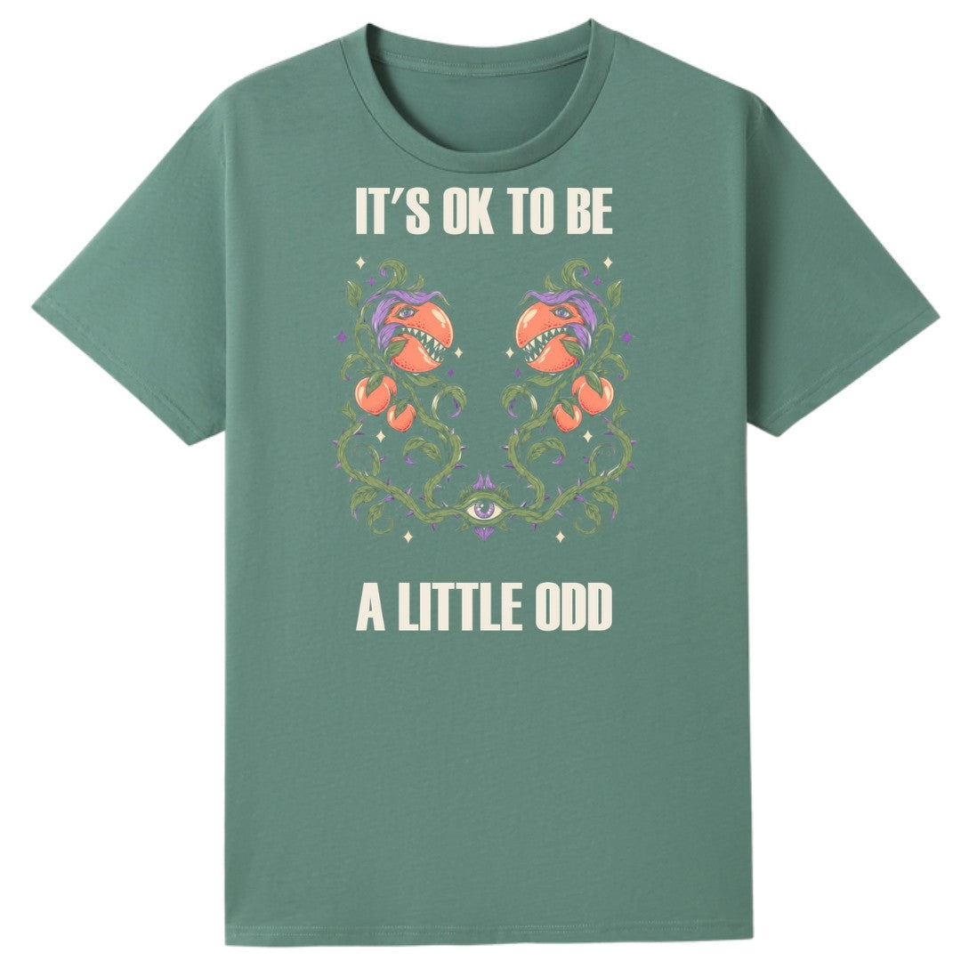 A slate green oversized tee with the It's OK To Be A Little Odd graphic printed large on the front.