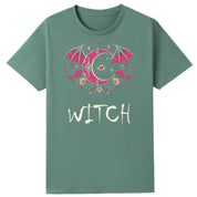 A slate green oversized tee with the Witch graphic printed large on the front.