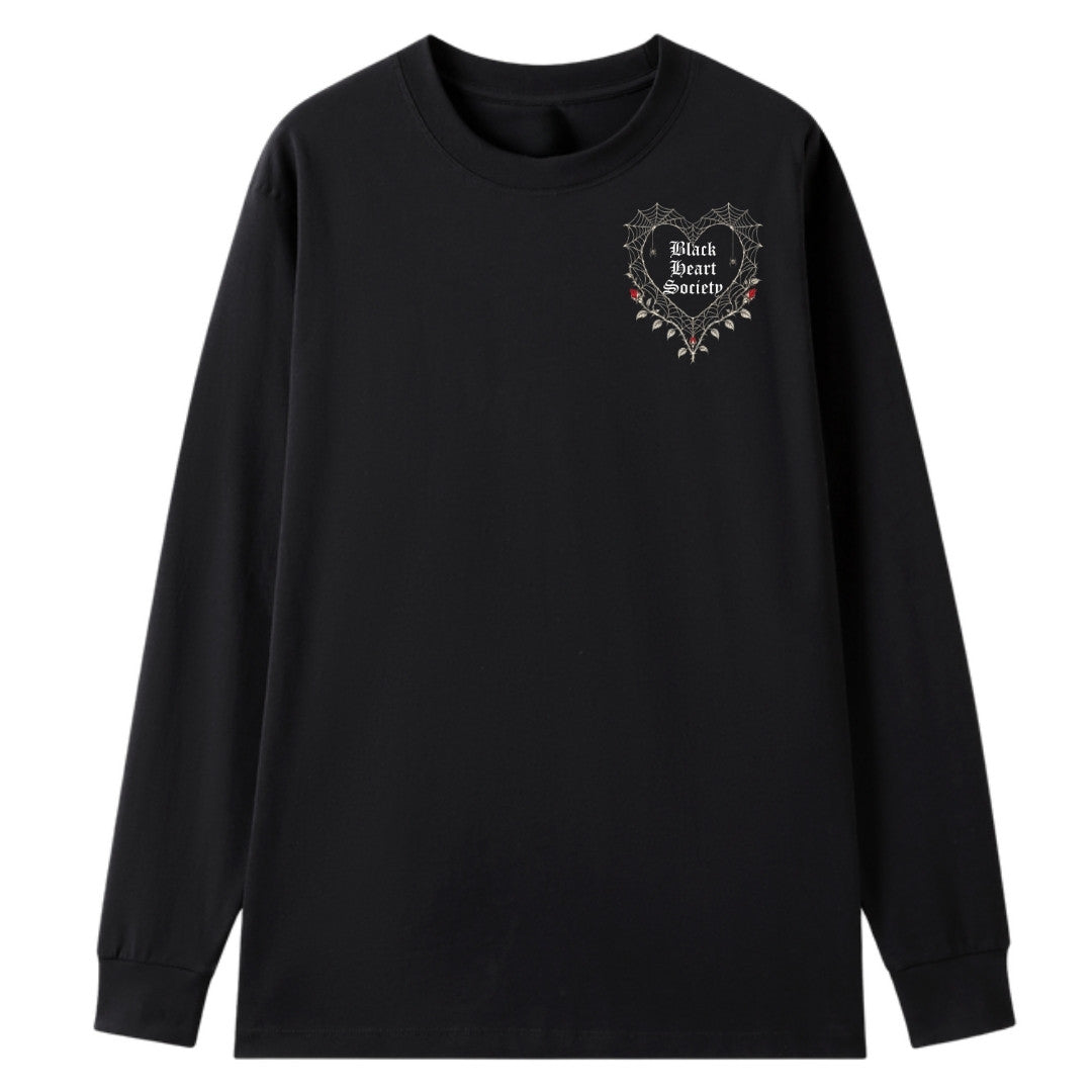 A black oversized long sleeve tee with a small Black Heart Society graphic on the left chest.