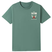 A slate green oversized tee with a small Get The Tattoo graphic on the left chest.