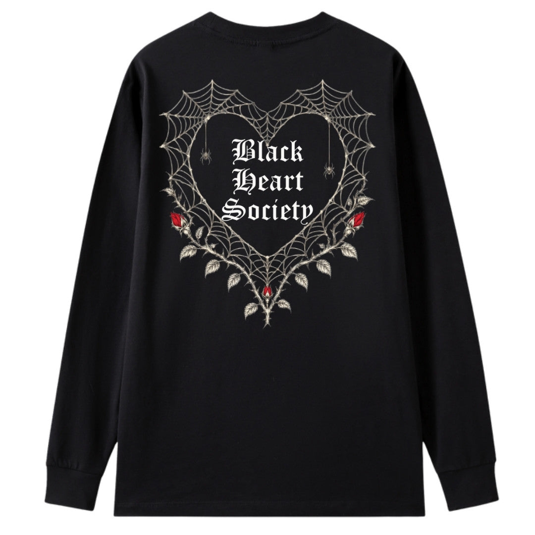 A black oversized long sleeve tee shown from the back, with the Black Heart Society graphic printed large across the back.