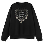 A black oversized crew neck with the Black Heart Society graphic printed large on the front.