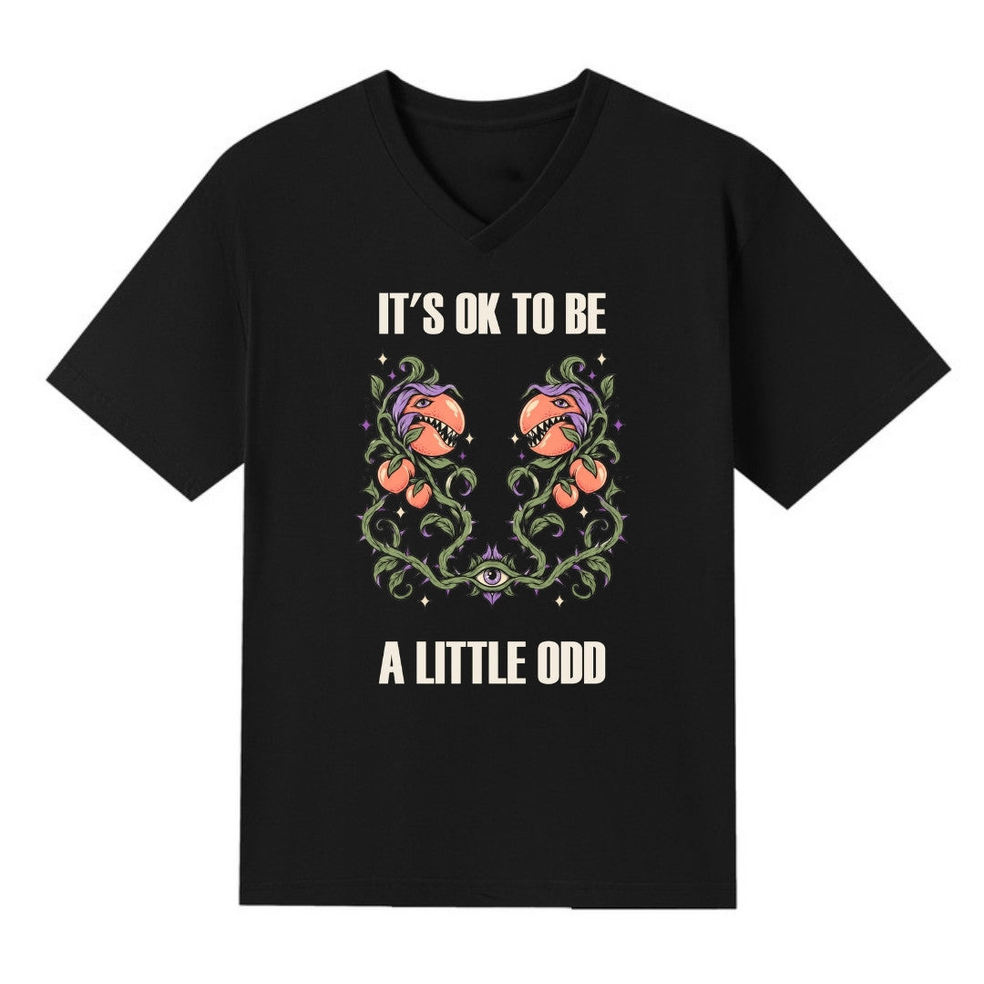 A black V-neck oversized tee with the It's OK To Be A Little Odd graphic printed large on the front.