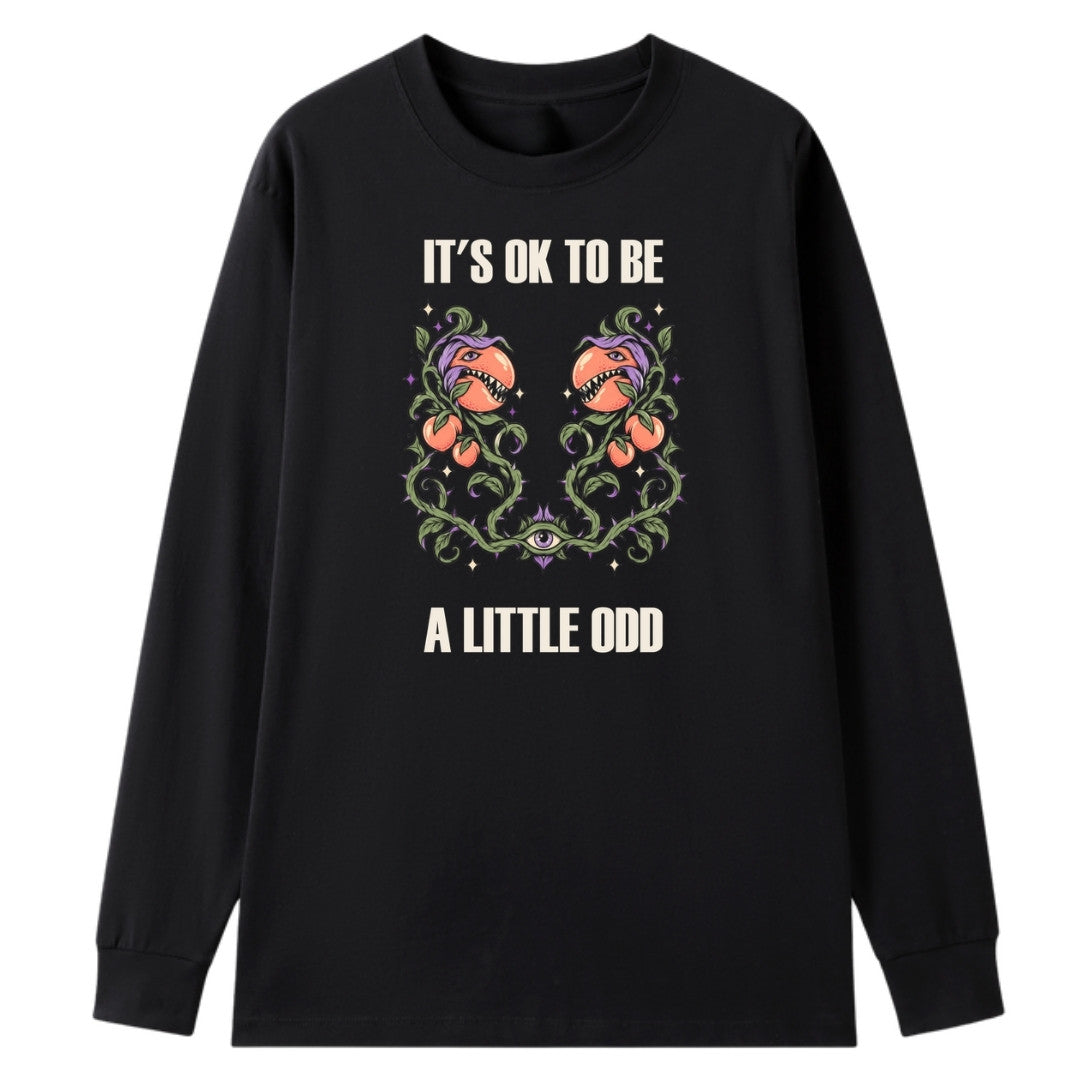 A black oversized long sleeve tee with the It's OK To Be A Little Odd graphic printed large on the front.