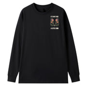 A black oversized long sleeve tee with a small It's OK To Be A Little Odd graphic on the left chest.