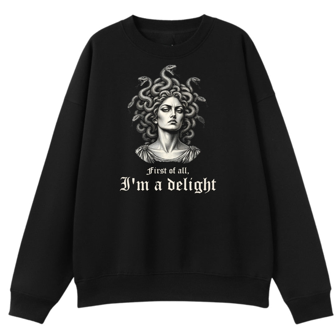 A black oversized crew neck with the First Of All I'm A Delight graphic printed large on the front.