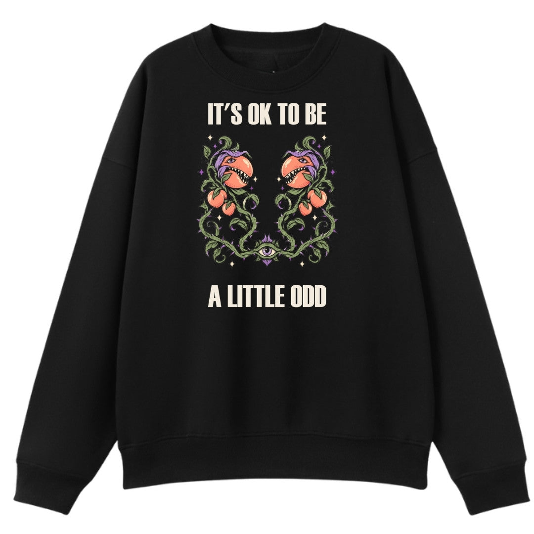 A black oversized crew neck with the It's OK To Be A Little Odd graphic printed large on the front.