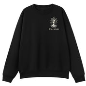 A black oversized crew neck with a small First Of All I'm A Delight graphic on the left chest.