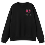 A black oversized crew neck with a small Witch graphic on the left chest.