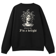 A black oversized crew neck shown from the back, with the First Of All I'm A Delight graphic printed large across the back.