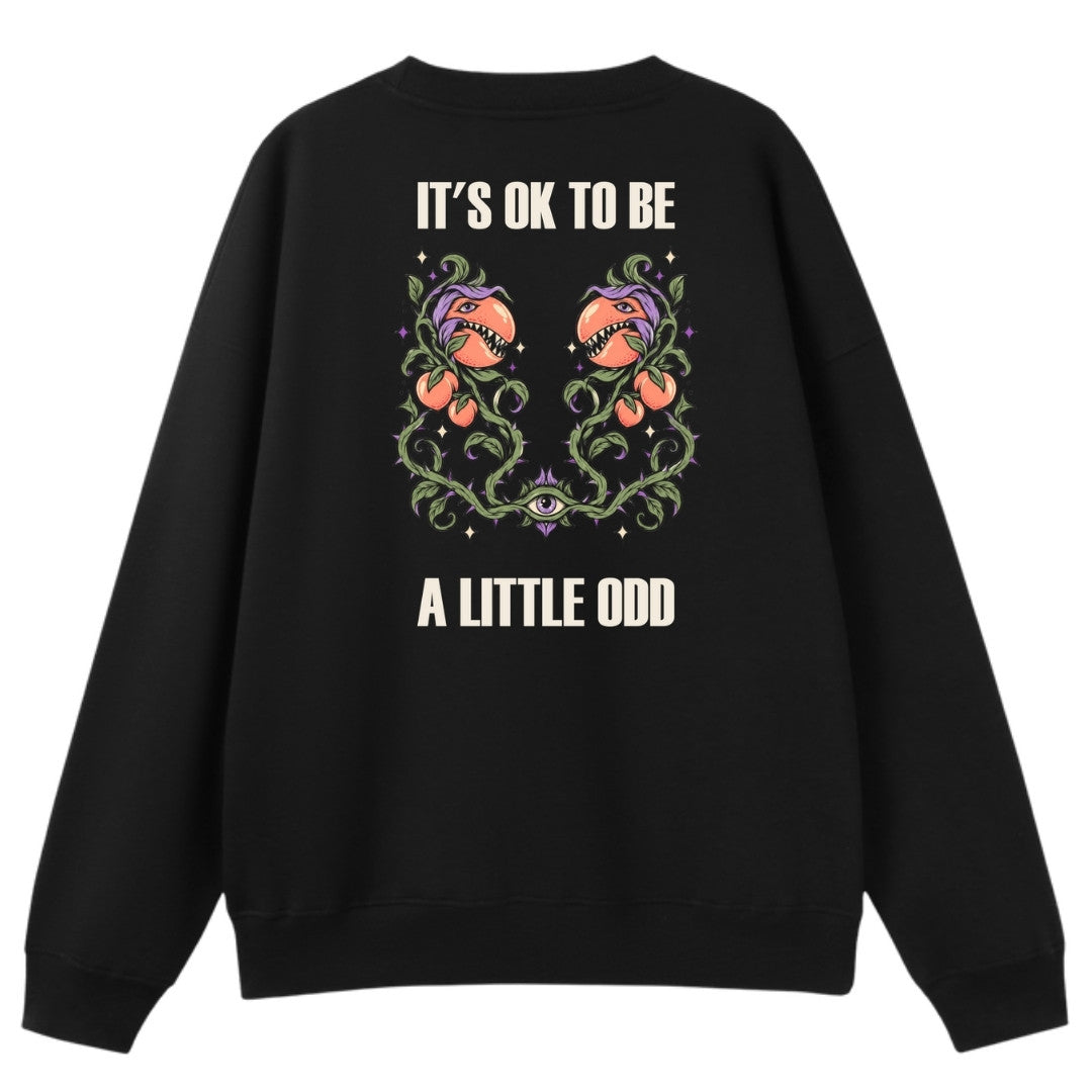 A black oversized crew neck shown from the back, with the It's OK To Be A Little Odd graphic printed large across the back.