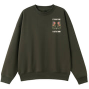 A army green oversized crew neck with a small It's OK To Be A Little Odd graphic on the left chest.