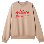A peach oversized crew neck with the Satan's Favourite graphic printed large on the front.