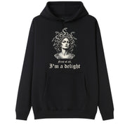 A black oversized hoodie with the First Of All I'm A Delight graphic printed large on the front.