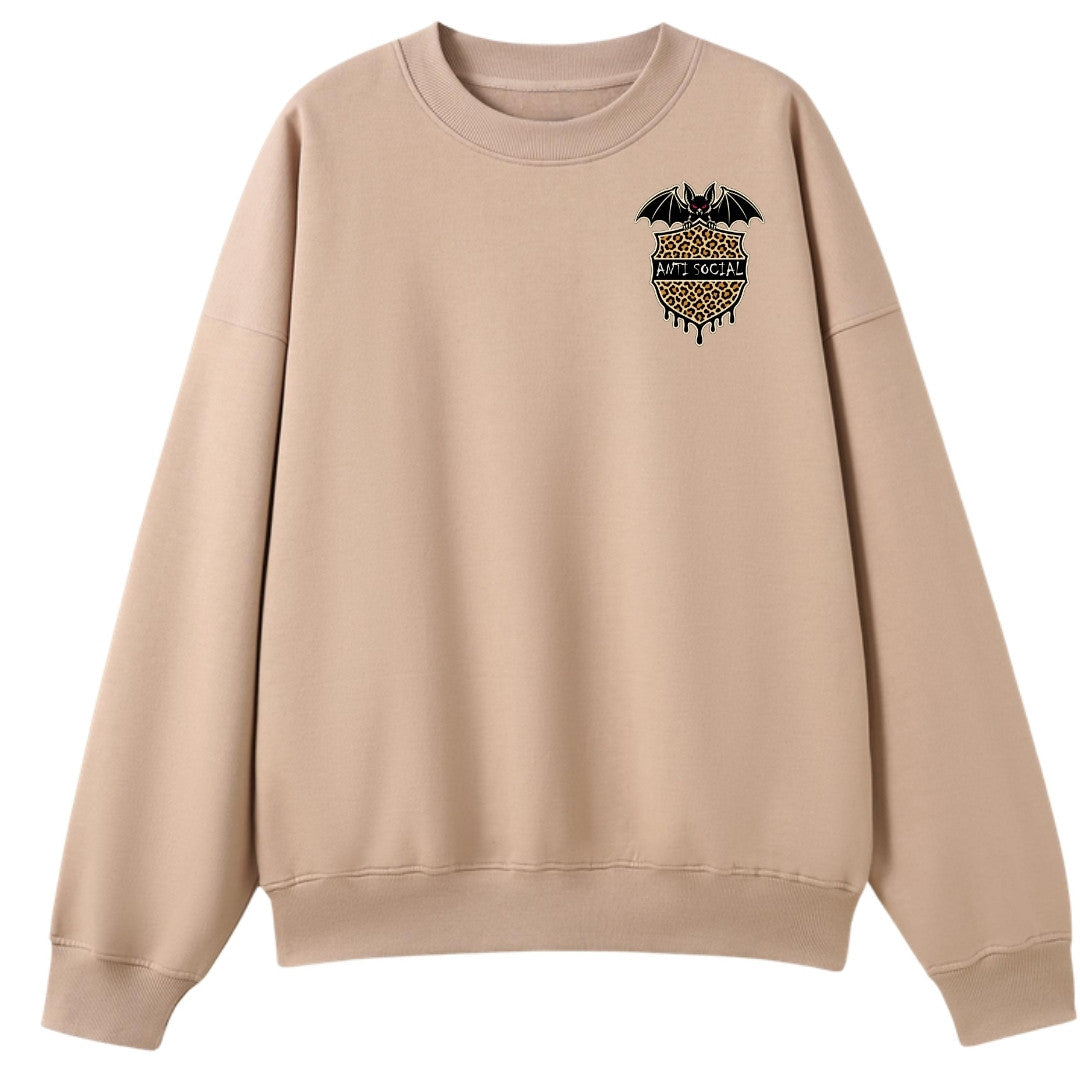 A peach oversized crew neck with a small Anti Social graphic on the left chest.
