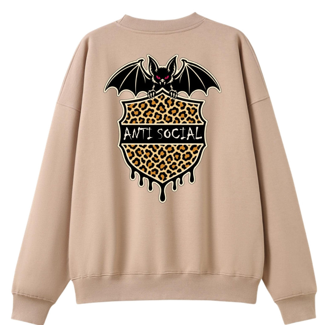 A peach oversized crew neck shown from the back, with the Anti Social graphic printed large across the back.