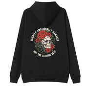A black oversized hoodie shown from the back, with the Slightly Emotionally Damaged graphic printed large across the back.