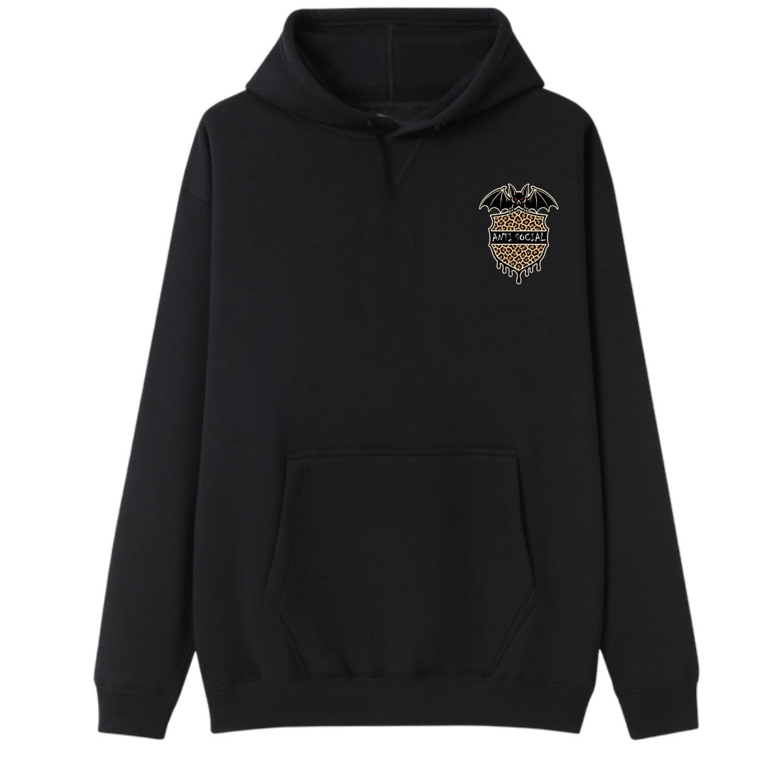 A black oversized hoodie with a small Anti Social graphic on the left chest.