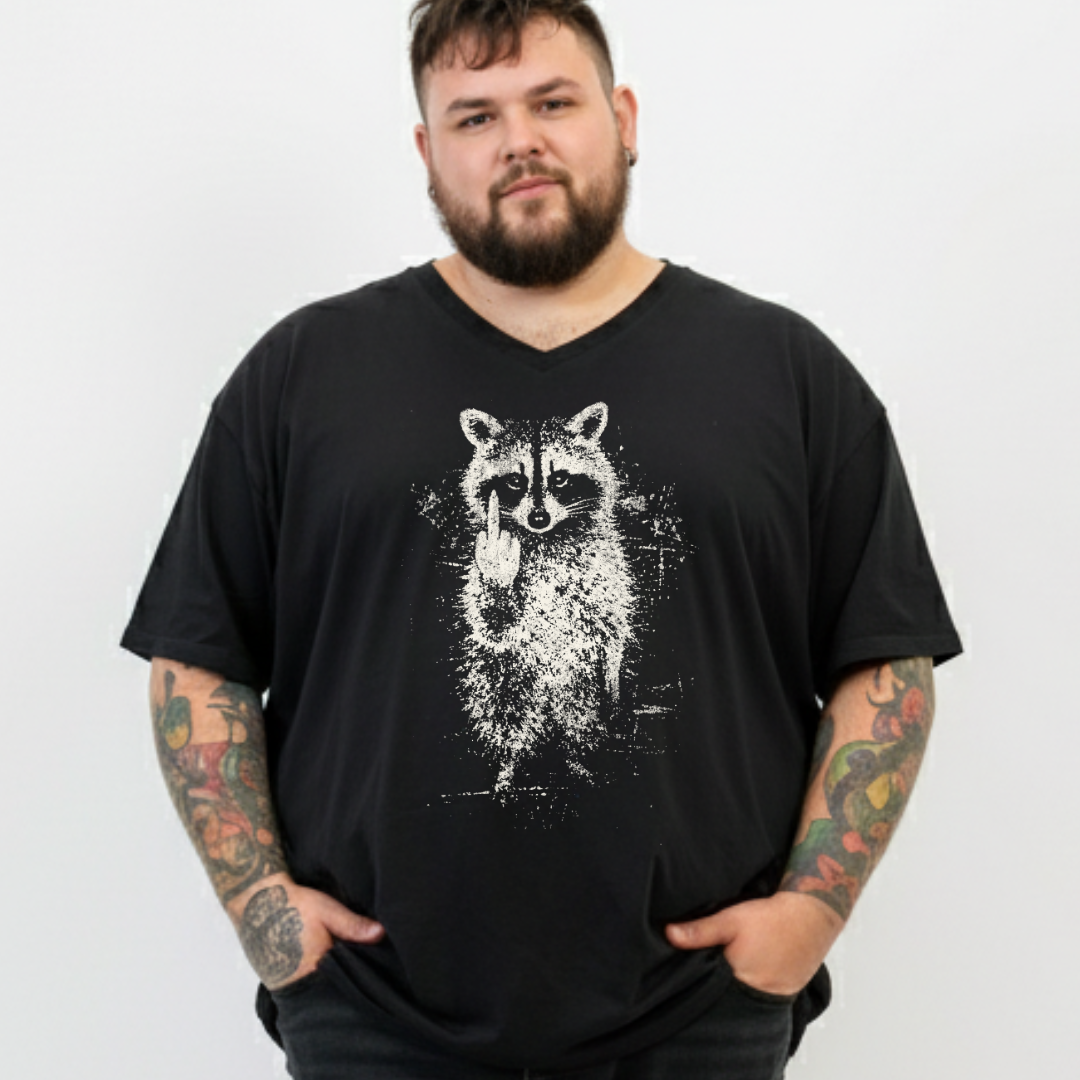 A man with a beard and tattooed arms wearing a black V-neck t-shirt with a white distressed raccoon graphic on the front, standing against a plain white background.
