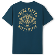 A dark teal blue short-sleeve t-shirt with a large gold graphic on the back. The graphic features a stylized tiger head with horns, flanked by two skulls, and the words 'HERE KITTY KITTY' in a distressed font.