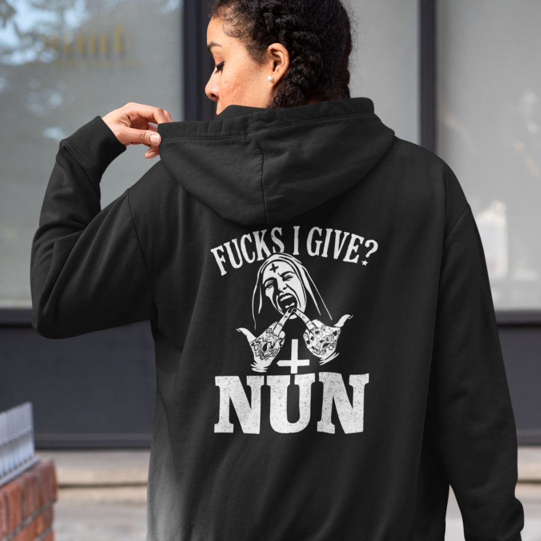 Person wearing a black hoodie with graphic design and text on the back.