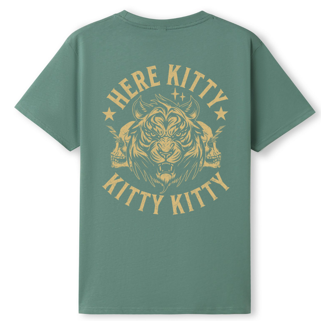 A sage green short-sleeve t-shirt with a large yellow graphic on the back featuring a tiger, skulls, and the text 'HERE KITTY KITTY'.