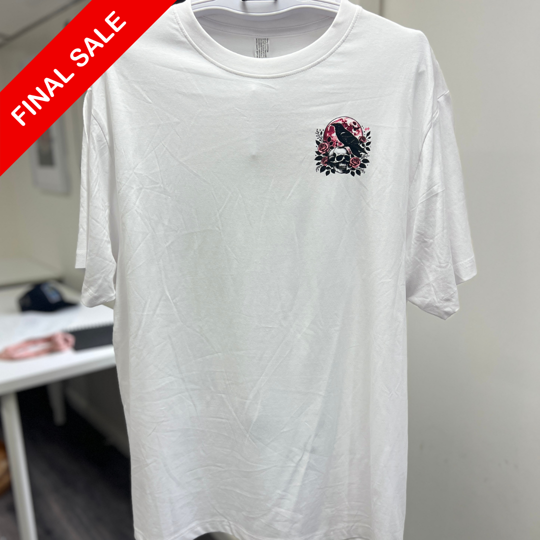 White t-shirt with a graphic design on a hanger against a neutral background