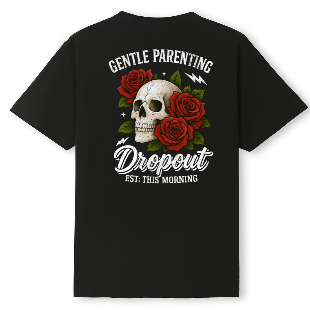 A black short-sleeve t-shirt with a graphic on the back featuring a white skull surrounded by red roses, with white text reading 'GENTLE PARENTING Dropout EST: THIS MORNING'.