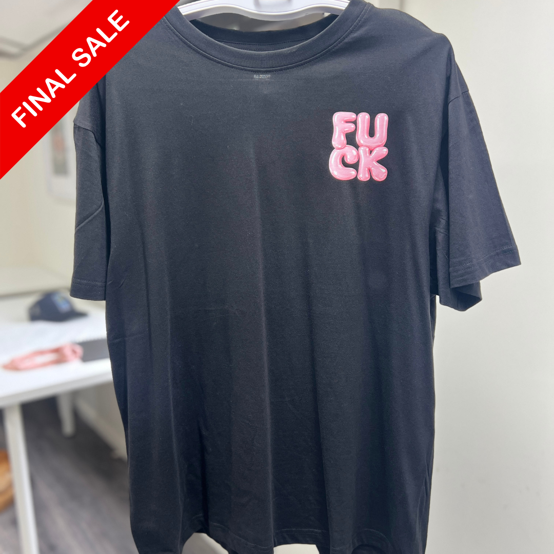 Black t-shirt with pink text on a hanger against a white wall, with a 'Final Sale' label.
