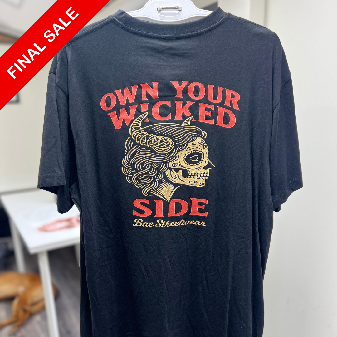 Navy blue t-shirt with red and gold graphic and text on a hanger.