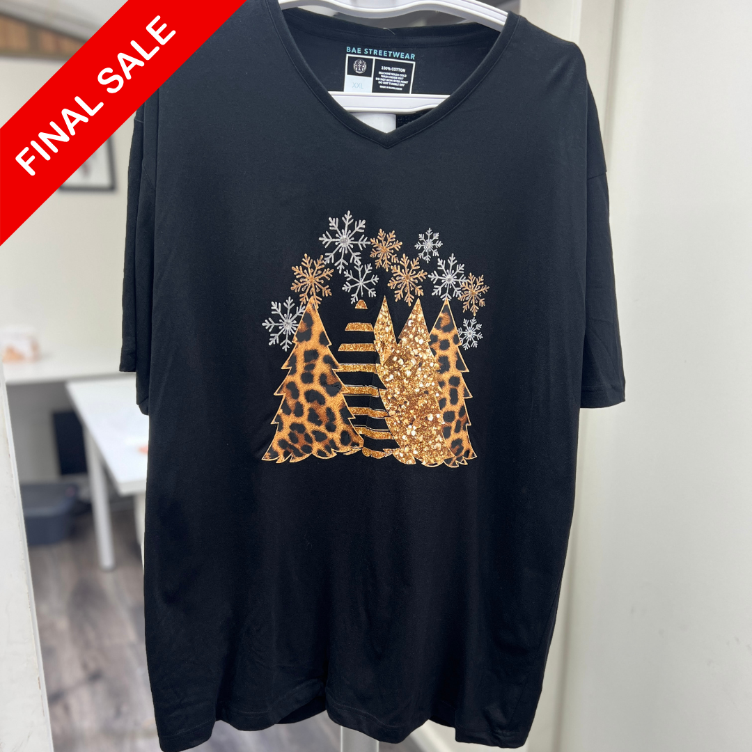 Black t-shirt with animal print design and snowflakes on a hanger, with 'Final Sale' label.