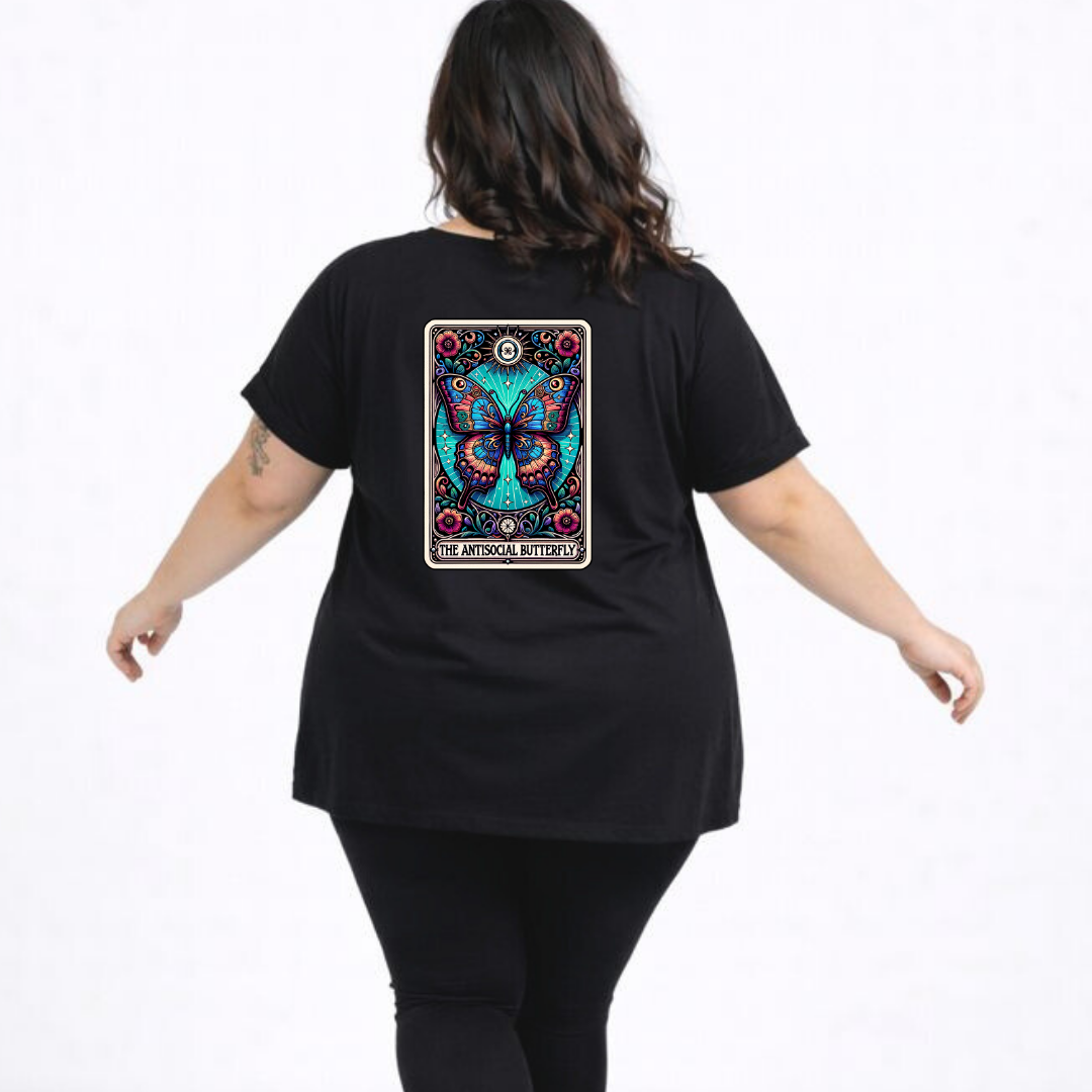 Person wearing a black t-shirt with a colorful butterfly design on the back, on a white background