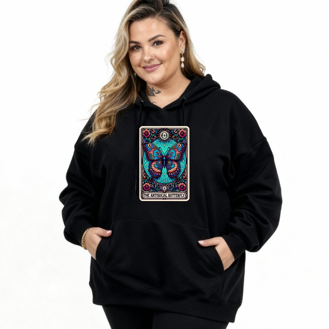 Person wearing a black hoodie with a colorful butterfly design on a white background