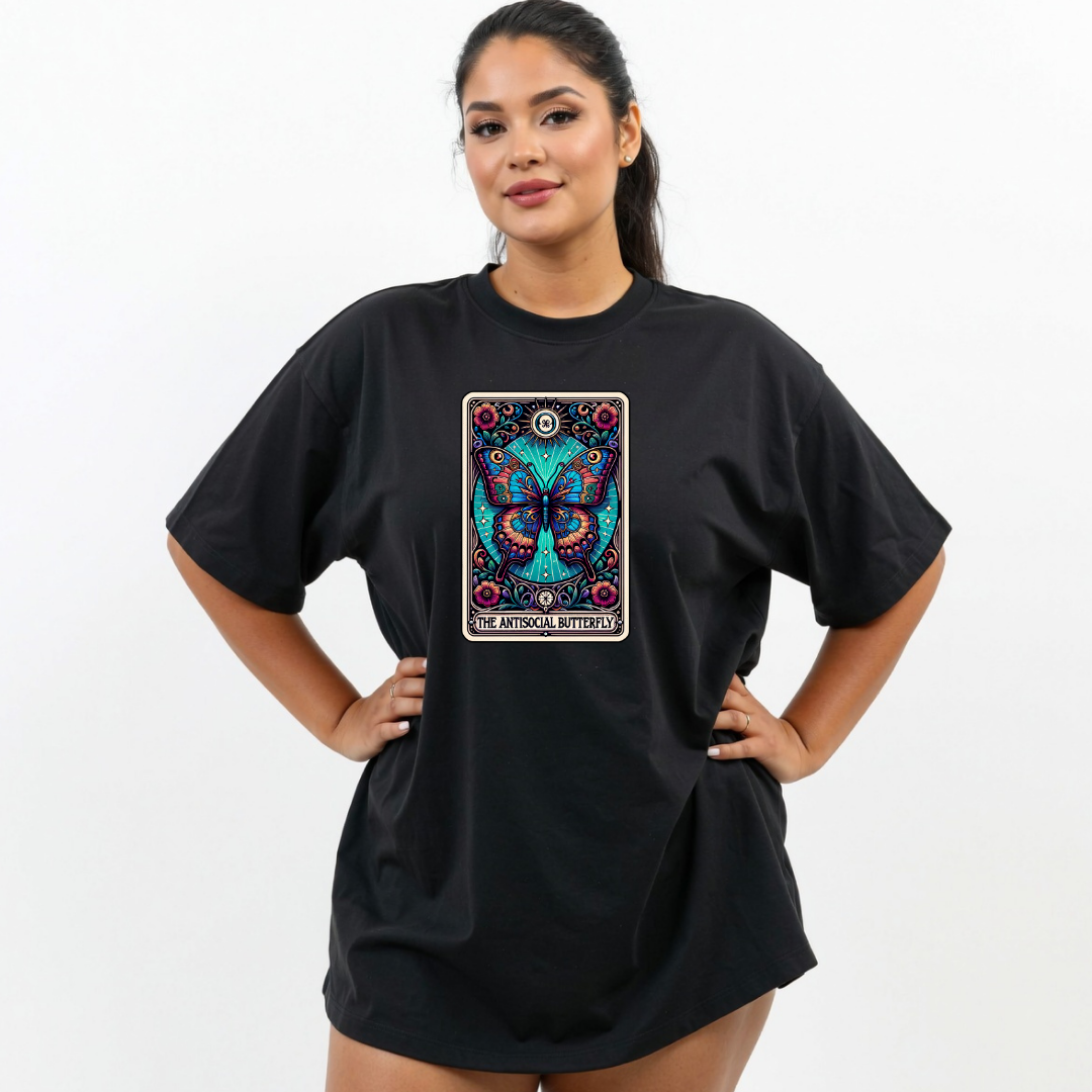 Woman wearing a black t-shirt with a colorful butterfly design on a white background