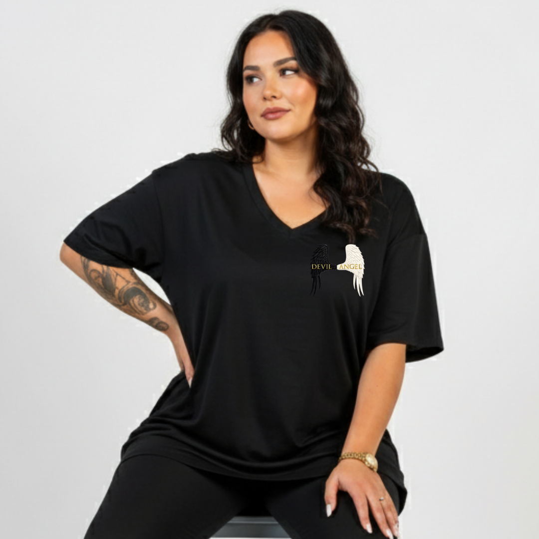 Woman wearing a black t-shirt with a logo on a light gray background