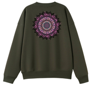 An olive green crewneck sweatshirt shown from the back, featuring a large, detailed circular mandala graphic in shades of pink, purple, and black on the upper back.