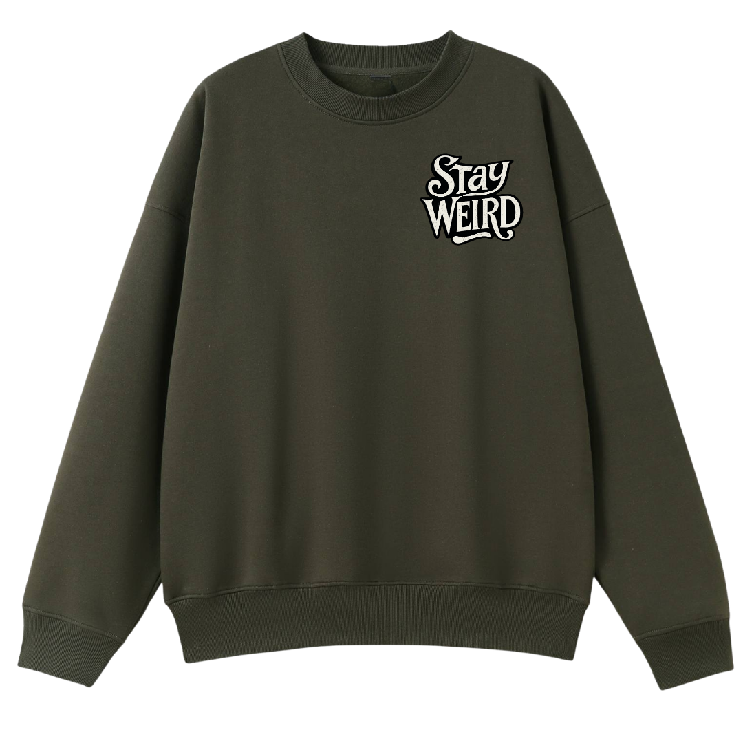 An olive green crewneck sweatshirt with a white graphic text print reading 'Stay WEIRD' on the left chest, displayed against a solid white background.