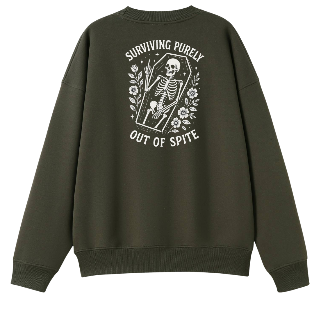 An olive green crewneck sweatshirt shown from the back, featuring a white graphic print of a skeleton in a coffin with flowers and the text 'SURVIVING PURELY OUT OF SPITE'.