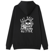 A black pullover hoodie shown from the back, featuring a large white graphic print of a skull with cat ears, checkered details, and the text 'CAT HAIR GLITTER' on a plain white background.