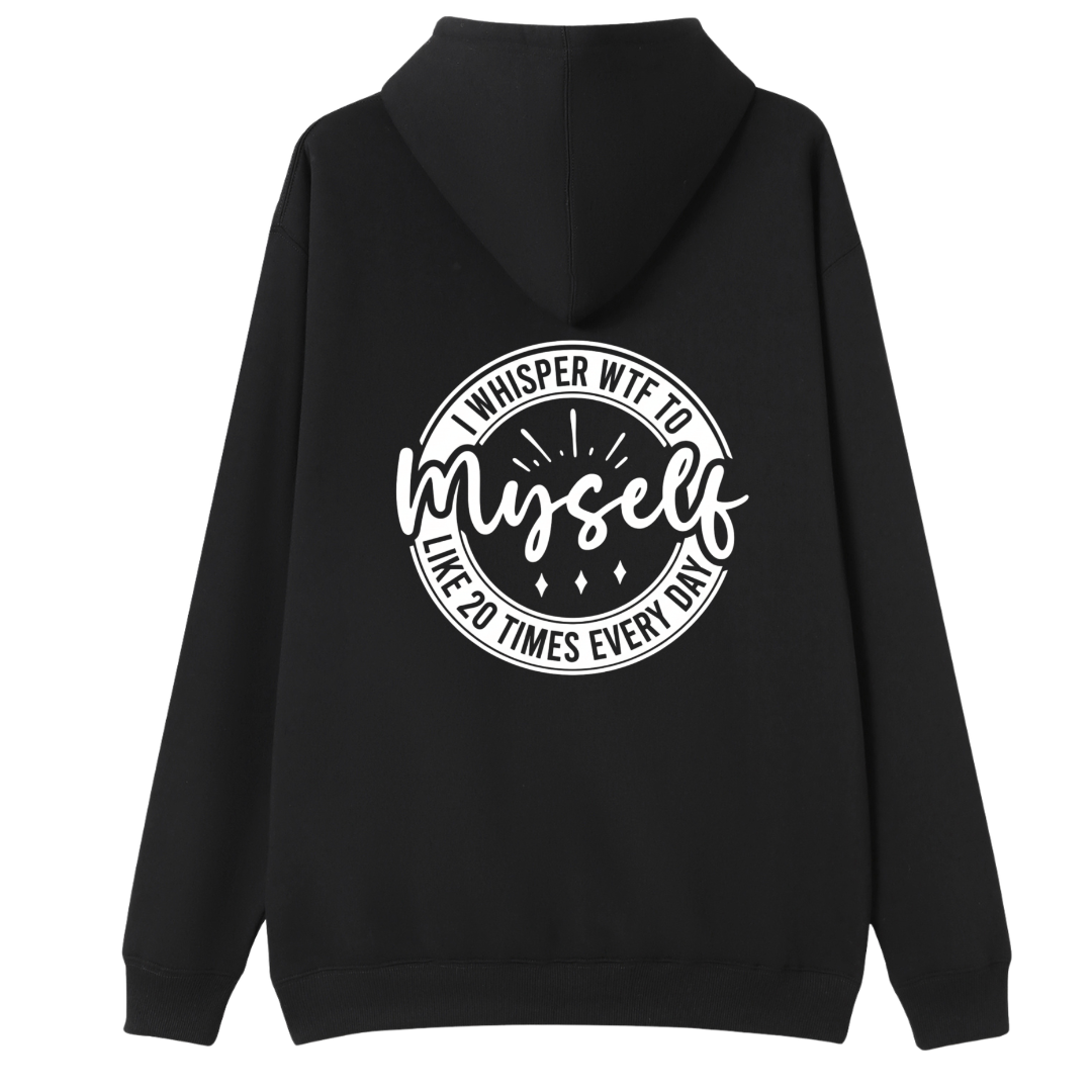 A black pullover hoodie shown from the back, featuring a large white circular graphic print with the text 'WHISPER WTF TO myself LIKE 20 TIMES EVERY DAY' on a plain white background.