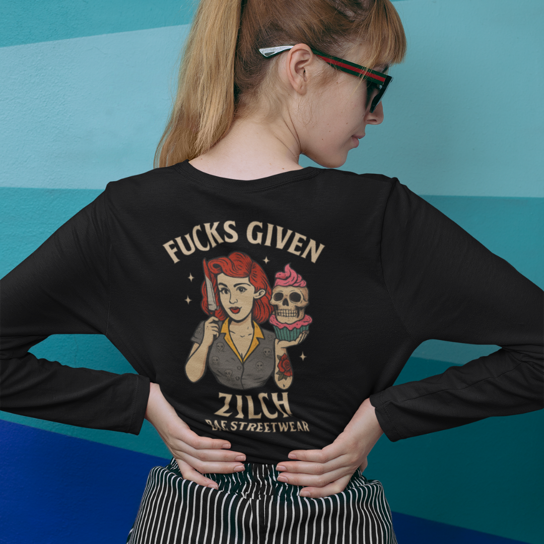 Plus-size black long sleeve tee with cream ‘Fucks Given, Zilch’ text above a red-haired pin-up skull woman holding a cupcake and knife graphic – limited-edition Melbourne streetwear by Bae Streetwear