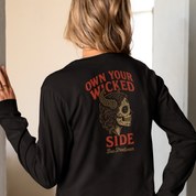 Plus-size black long sleeve tee with red ‘Own Your Wicked Side’ text above devil-horned sugar skull woman graphic – limited-edition Melbourne handmade streetwear by Bae Streetwear